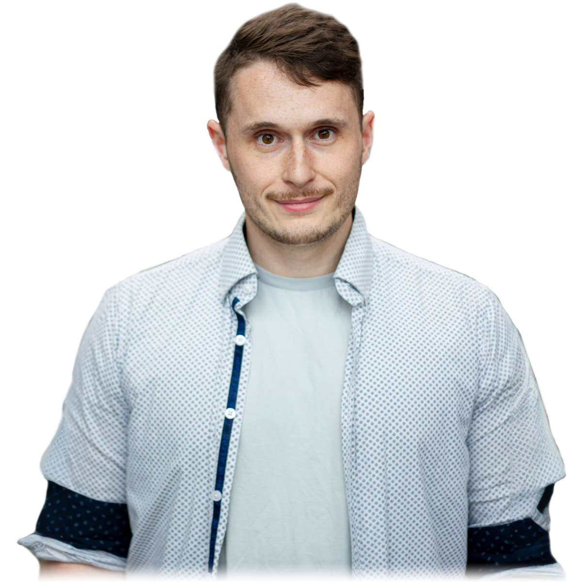 A headshot of David wearing an unbuttoned white collared shirt.